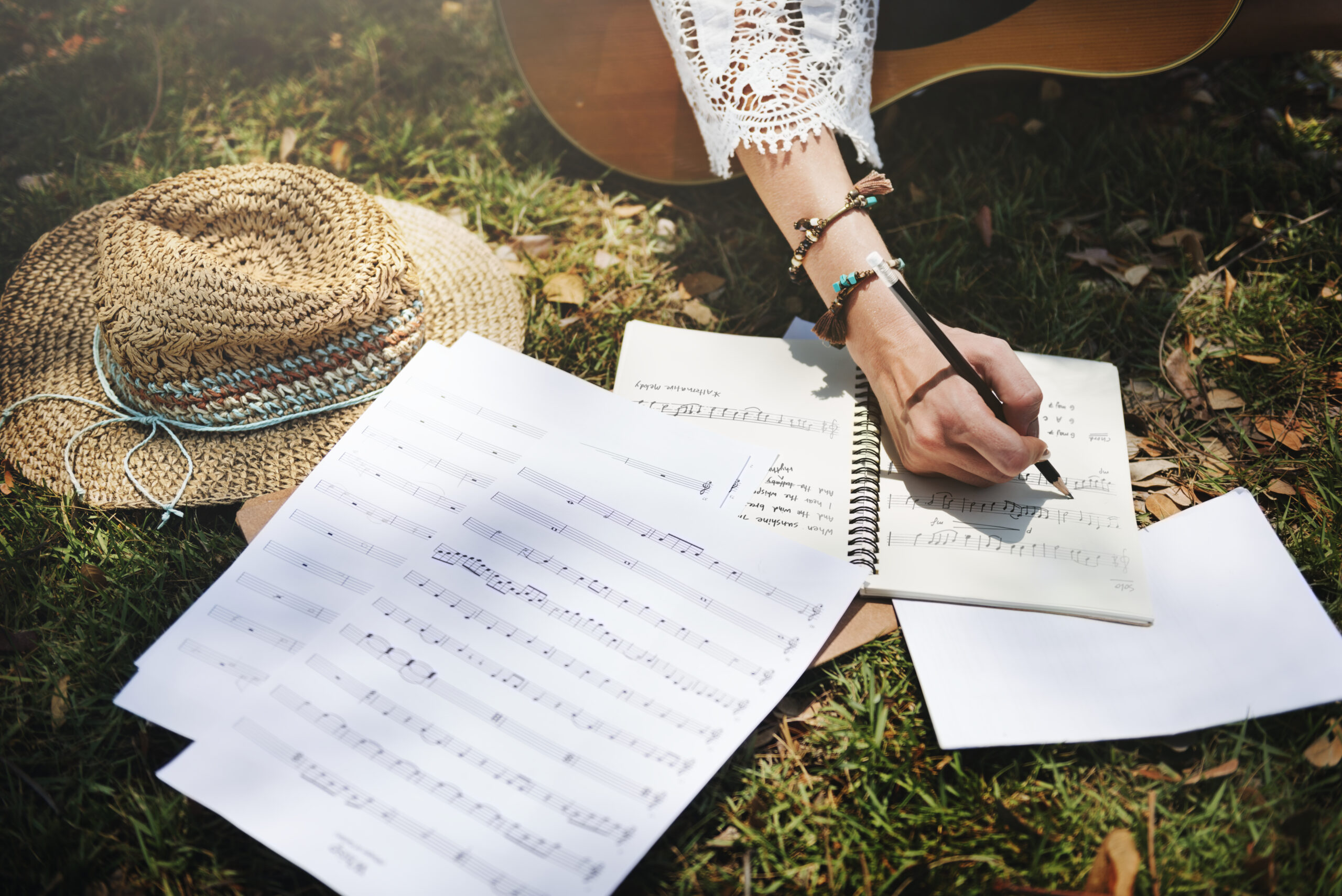 Woman writing down some lyrics